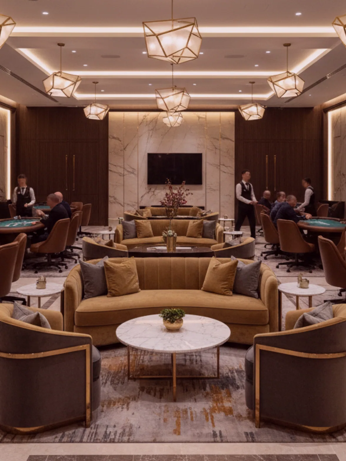 The card room set for the evening, four tables under the original high windows.