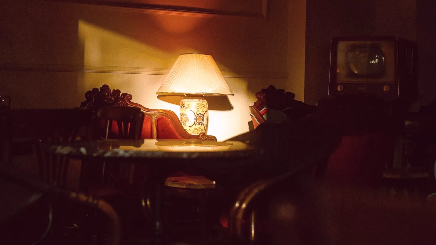 The quiet corner near the tables, kept for guests waiting on a seat.
